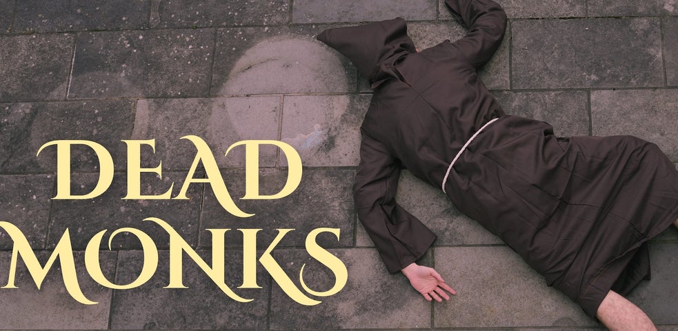 A person in brown monk's dress lying face down on stone floor