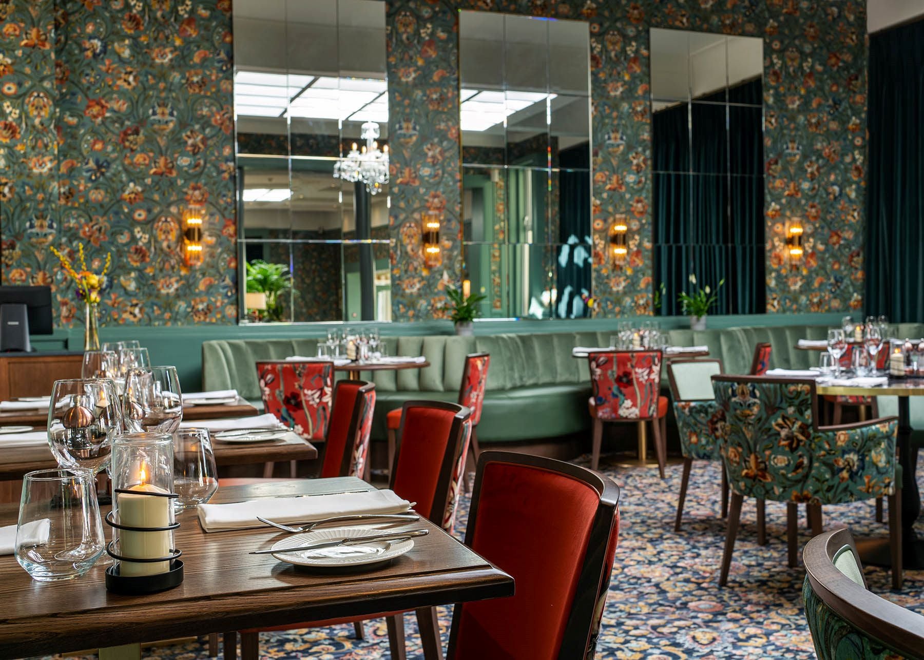Elegant interior of The Proleek Restaurant with comfortable chairs and chandeliers