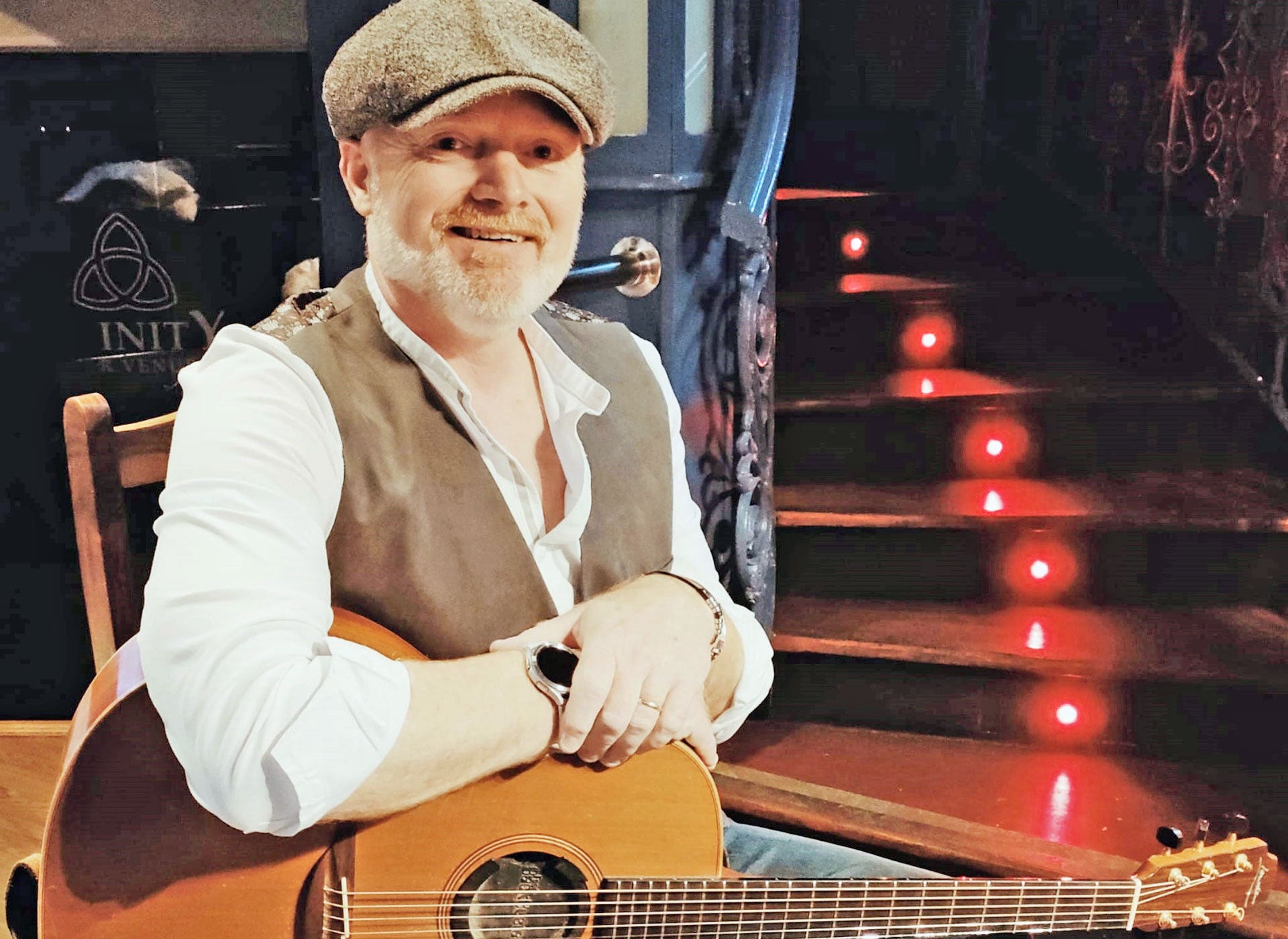 Irish Songs and Stories acoustic guitar player