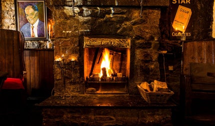 A view of the turf burning open fireplace at The Bloody Stream