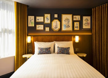 Double bed with white sheets