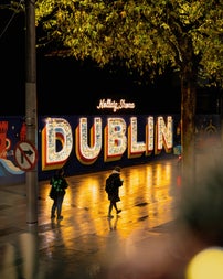 View from the Top Deck of the bus while on O'connell street. You can see a sign of Dublin light up for the festive period.