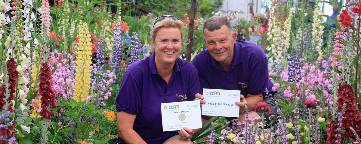 The owners holding the award they won in Bloom Garden Festival