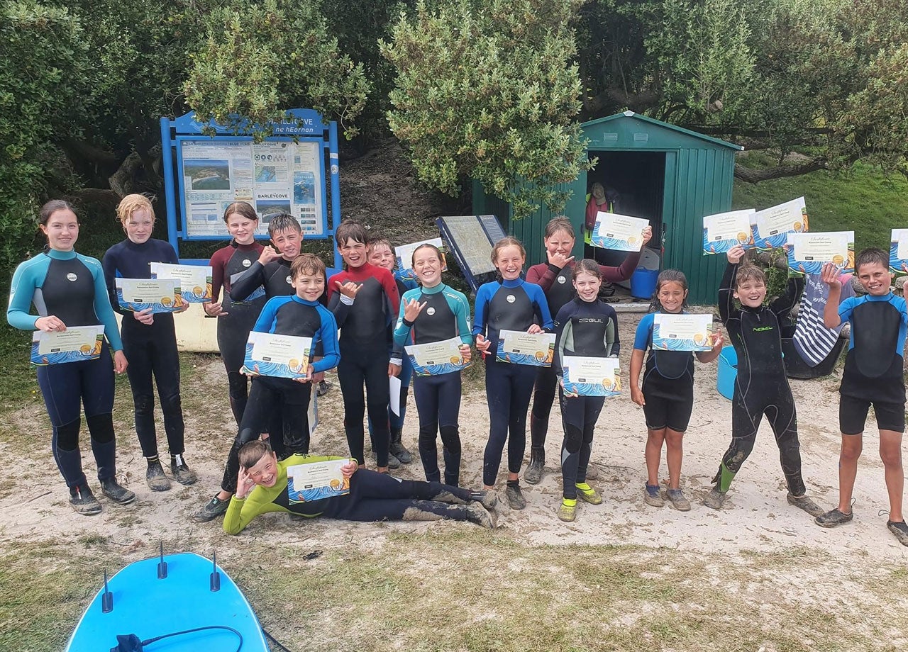 Group at Barleycove Surf Camp with their certificates of completion