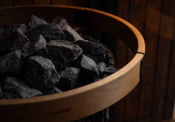 Close up of sauna stones on a sauna stove