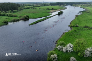 Elevated view of a river with green fields either side.