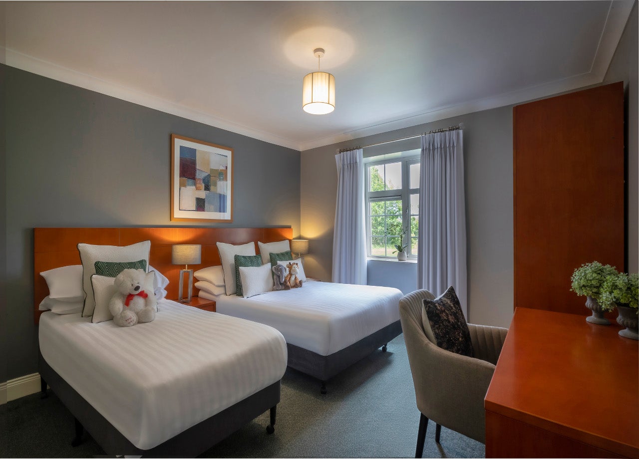 Two double beds with white sheet