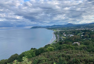 Aerial view of a coastline with mountains in the background
