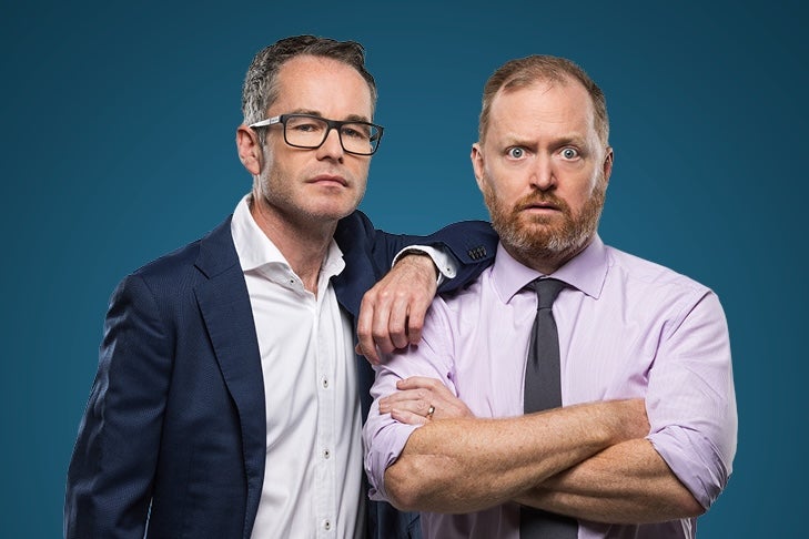 W*nkernomics, Just Touching Base - 2 men in work shirts, one looking shocked.