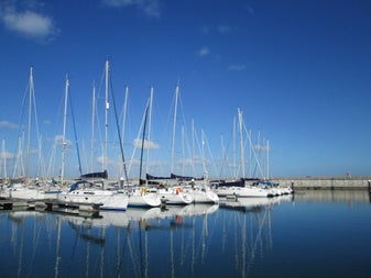 Berthed yachts at the marina.