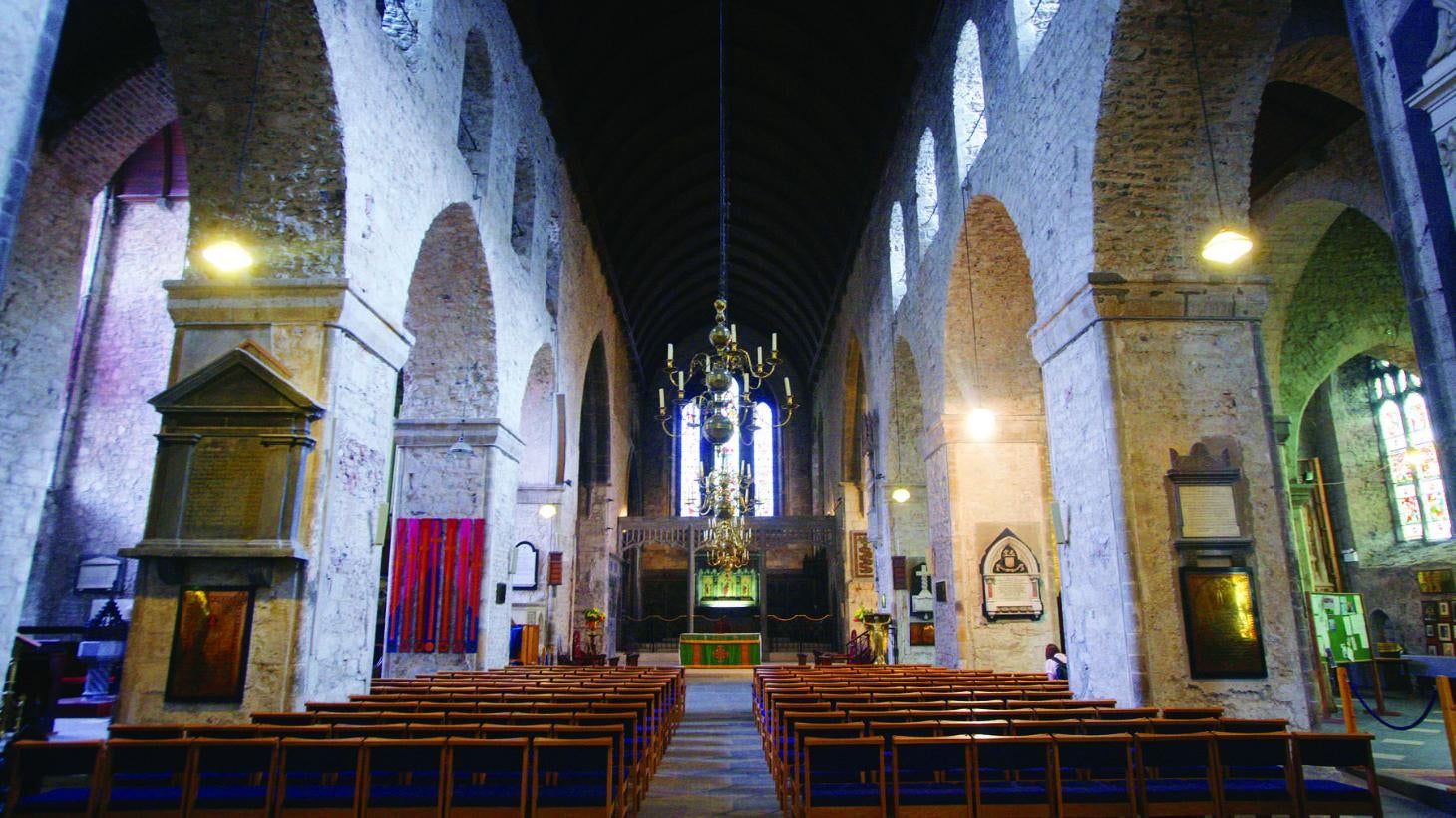Row a pews in front of an alter inside Saint Mary's Cathedral, Limerick