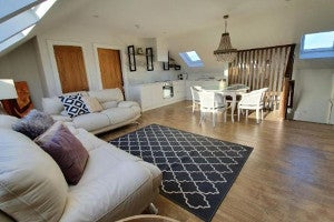 Sitting room with cream couches
