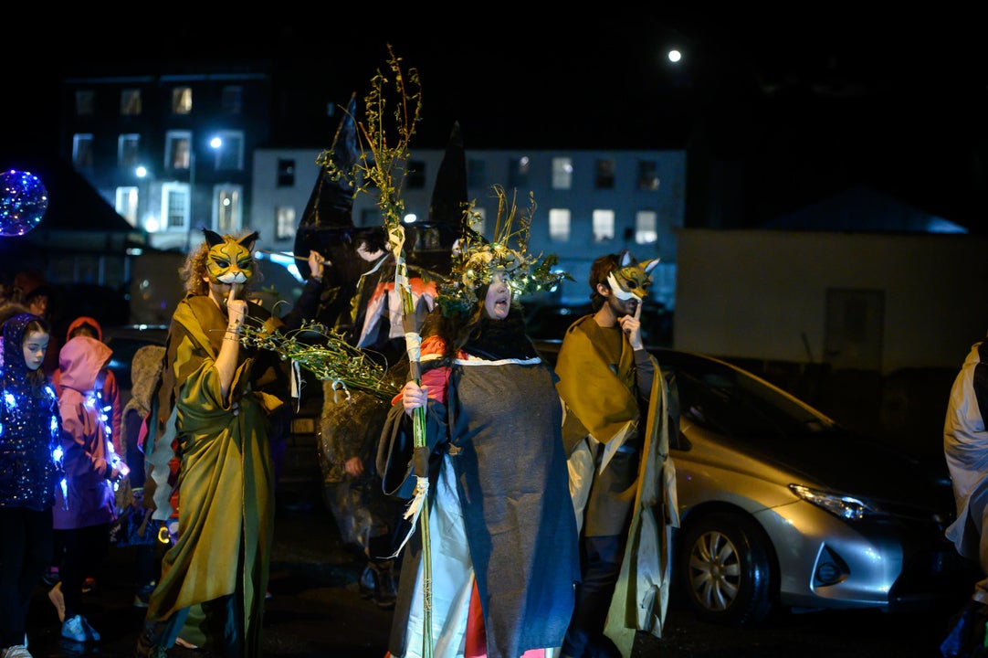 people and artists in parade