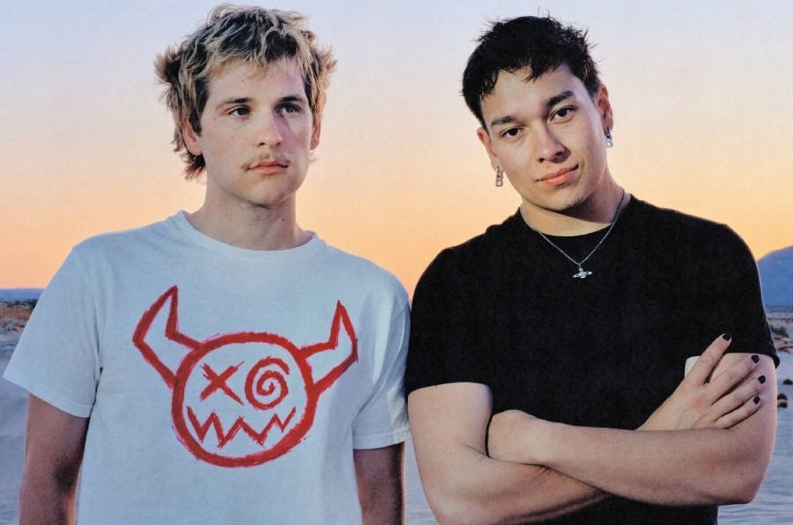 Joey Valence & Brae, 2 men in T-shirts with desert behind.