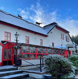 A view of the front exterior of Taylors Three Rock pub
