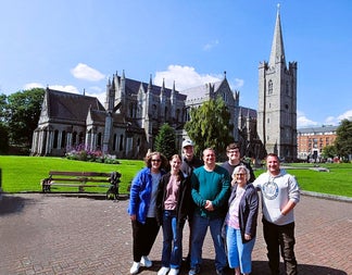A tour group posed with Christchurch Cathedral in the background