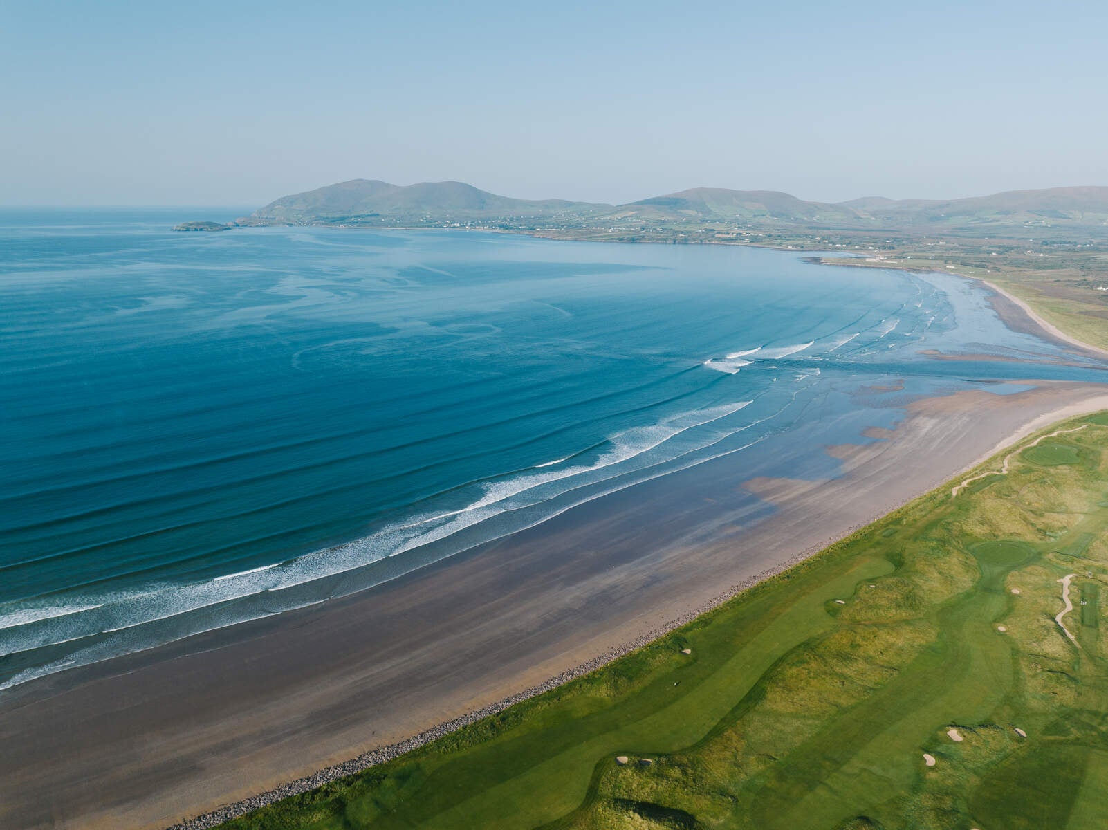 Aerial view of a sandy beach and blue seas