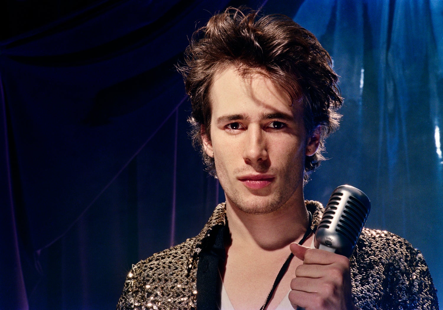 Jeff Buckley holding a microphone.