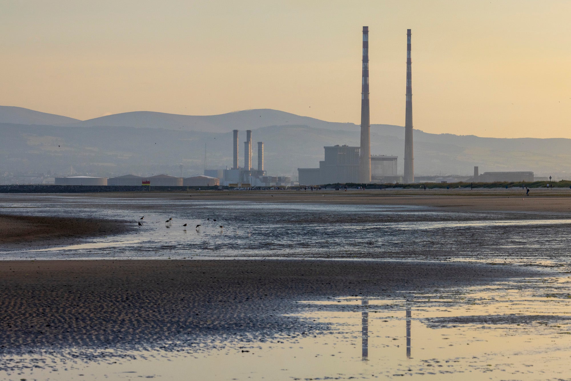 A view of the Poolbeg Chimneys from Dollymount Strand in County Dublin