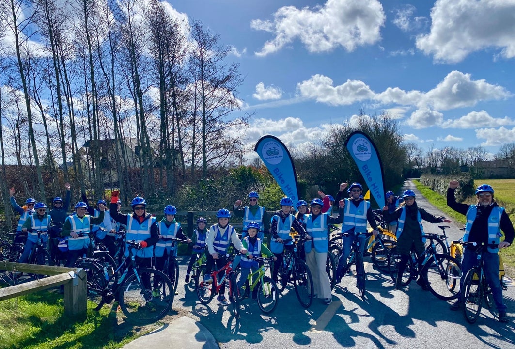 A large group of people out cycling with East Coast Bike Hire