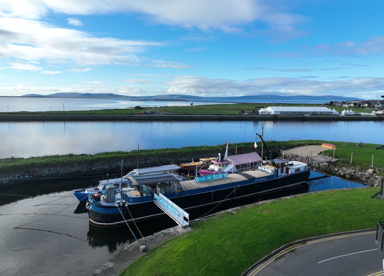 Exterior of a large boat with business signs