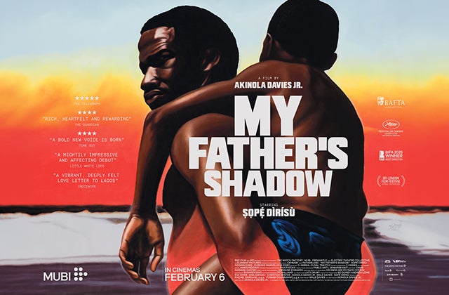 On a film poster, a man is carrying his son on his back.