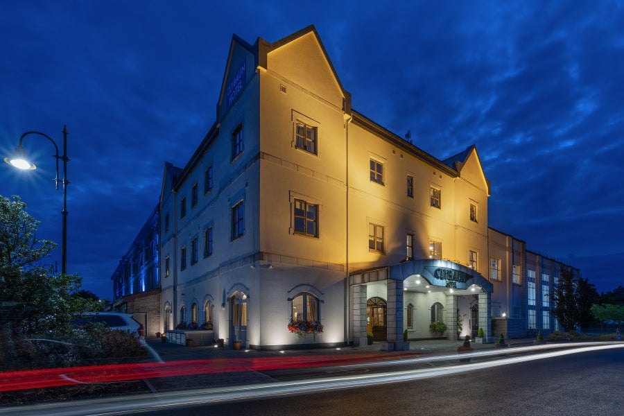 Exterior of the hotel by night.