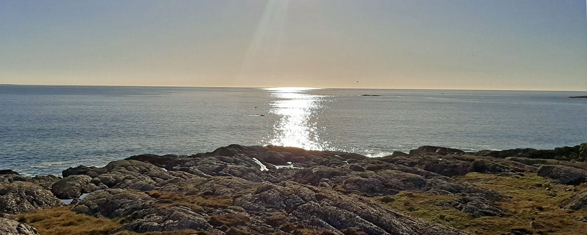 Ionad Na Feamainne Seaweed Centre coastline at sunset