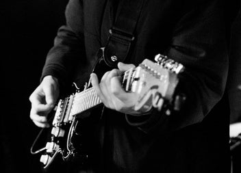 Gentleman playing an electric guitar