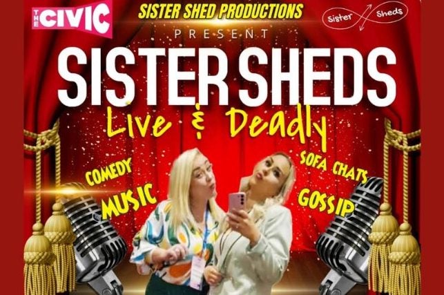 2 women posing for selfies with images of a stage with red curtains and old style large mics.