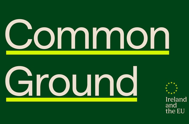 Green graphic with white writing spelling out Common Ground Ireland and the EU