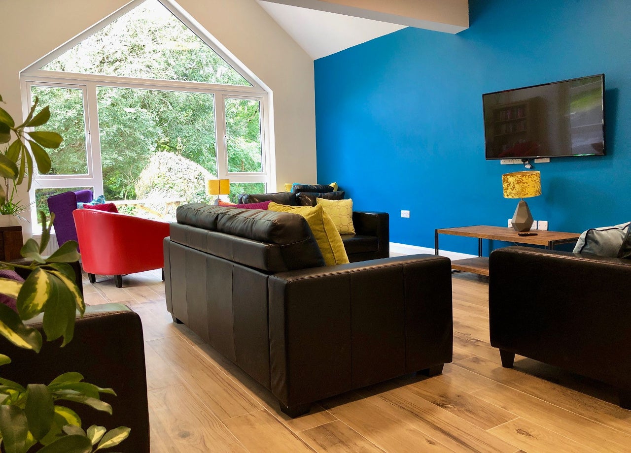 View of sitting room with couchs and chairs