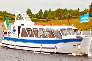 A boat on the water with Irish flag