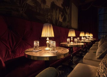 Seating by lamp lit tables at the Stella Cocktail Club
