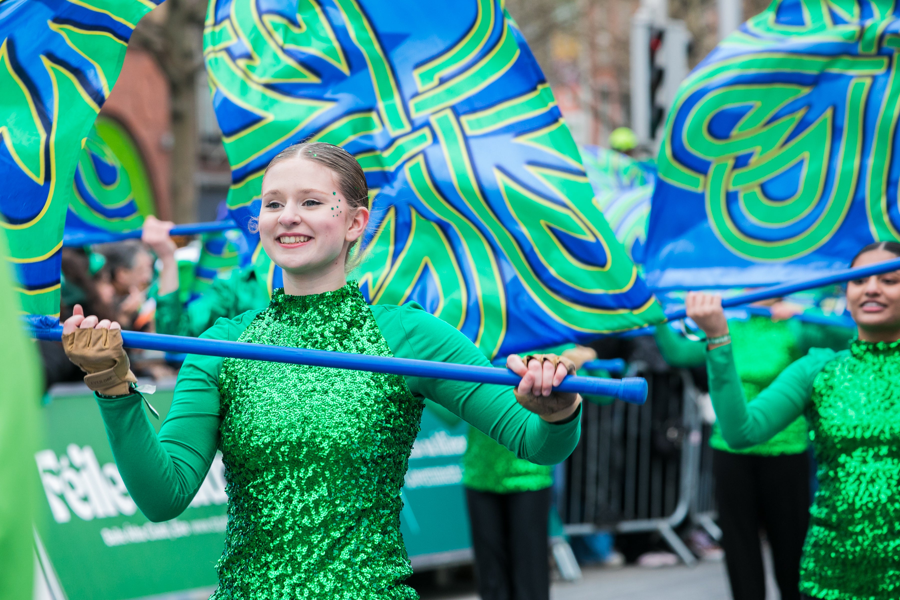 A young woman performing in a color guard at the St Patrick's Festival Dublin parade.