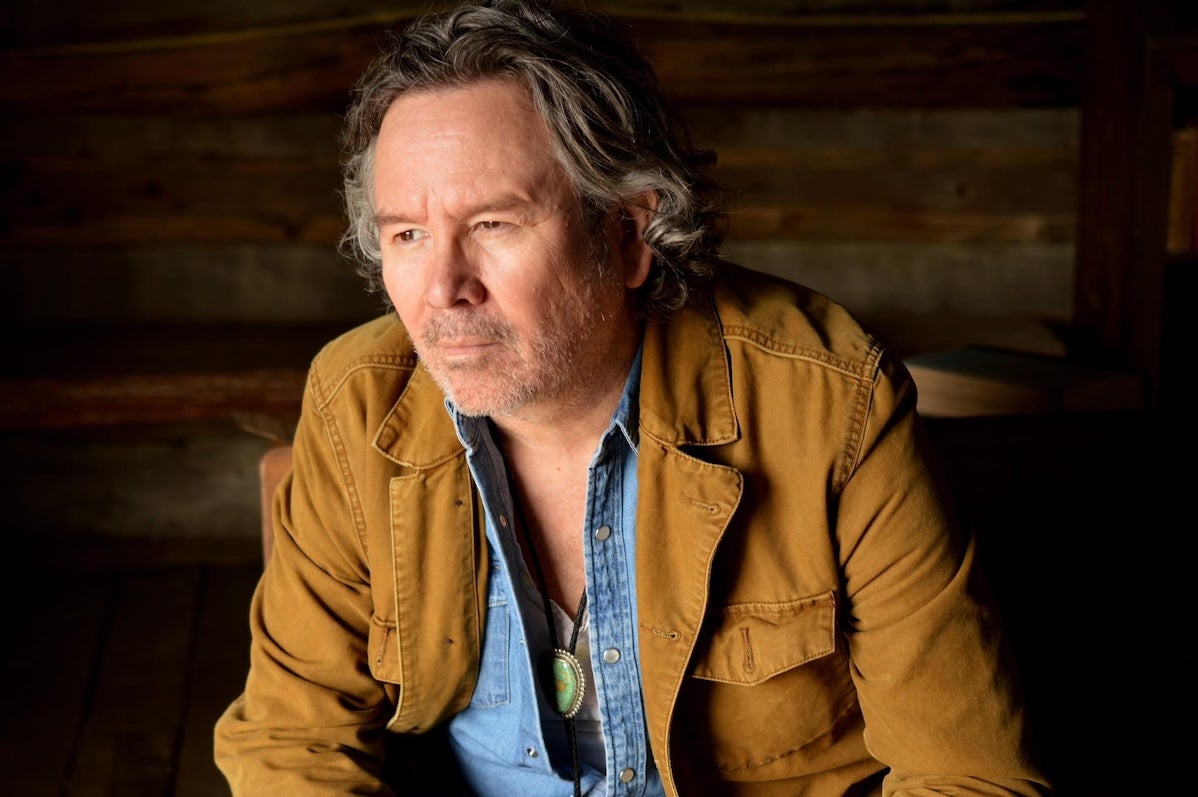 A man looking thoughtful, looking away to this right