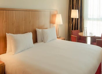 Double bedroom with white sheets 