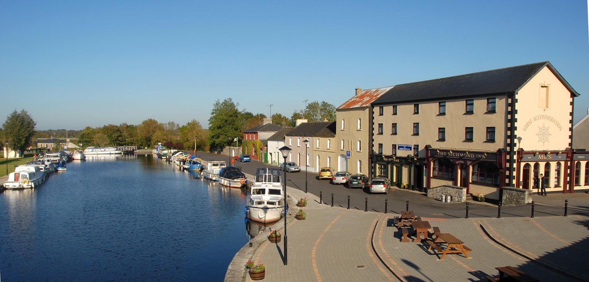 An image of the small tranquil village of Cloondara with the boats docked in the harbour