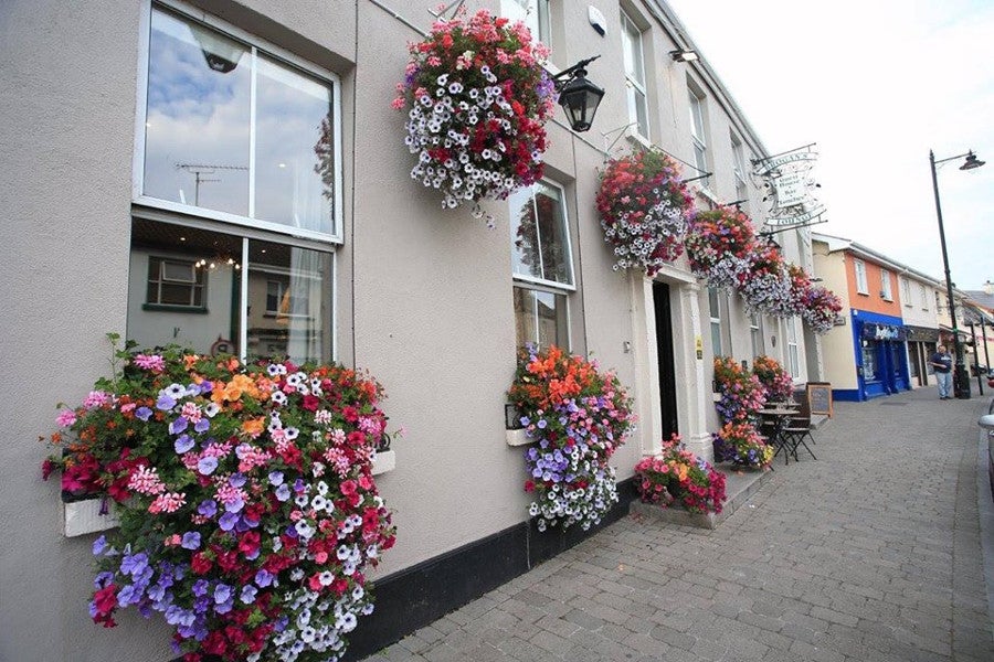 Front view of guesthouse with flowers