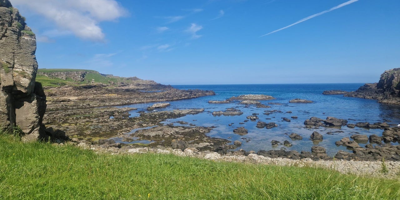 A view of a rocky shoreline with Wander Éire Tours