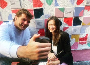 Taking a photograph while enjoying a modern and contemporary public art tour with Artful Tours