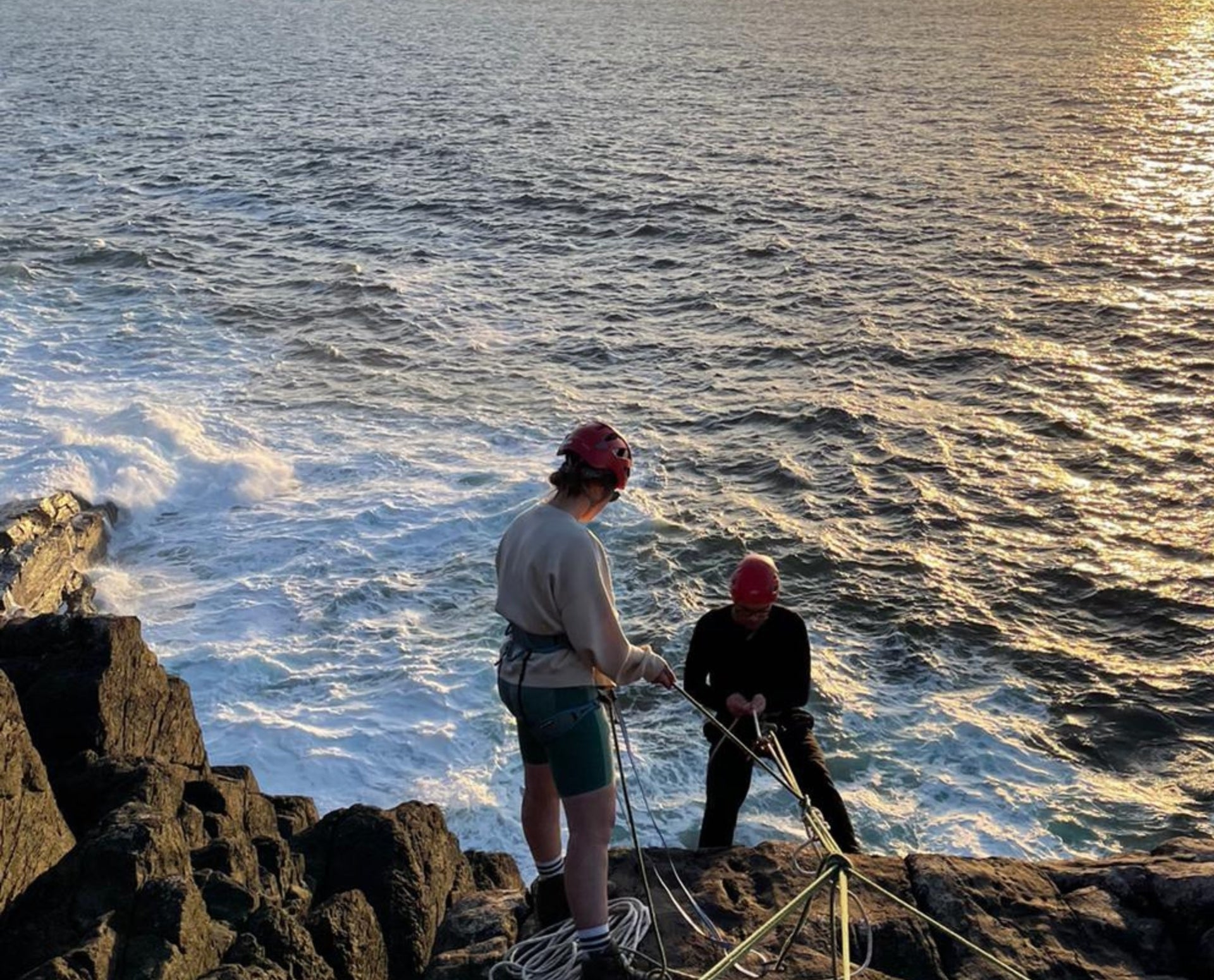 Abseiling from cliff face
