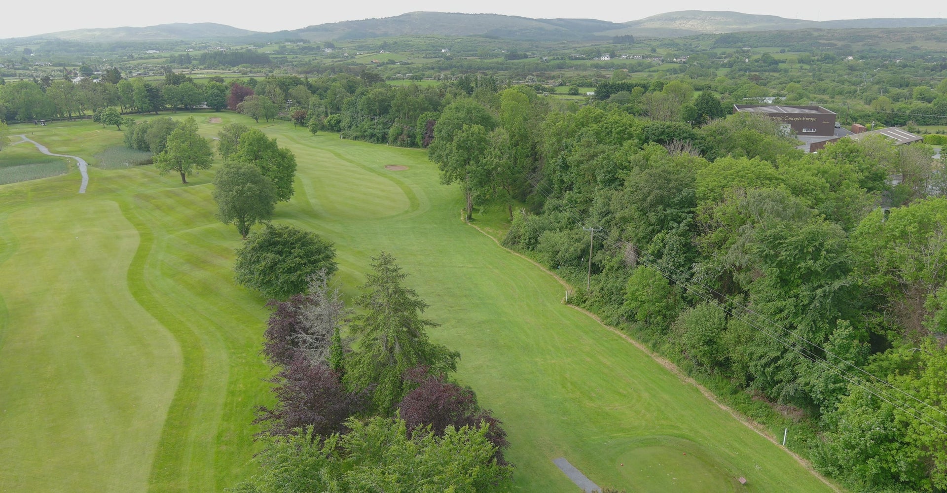 An aerial view over the fairways of a golf course
