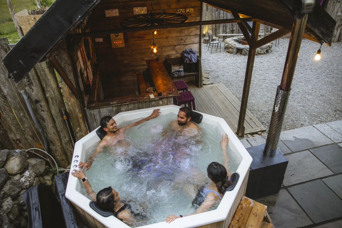 Four people in a hot tub at Mayo Glamping in County Mayo