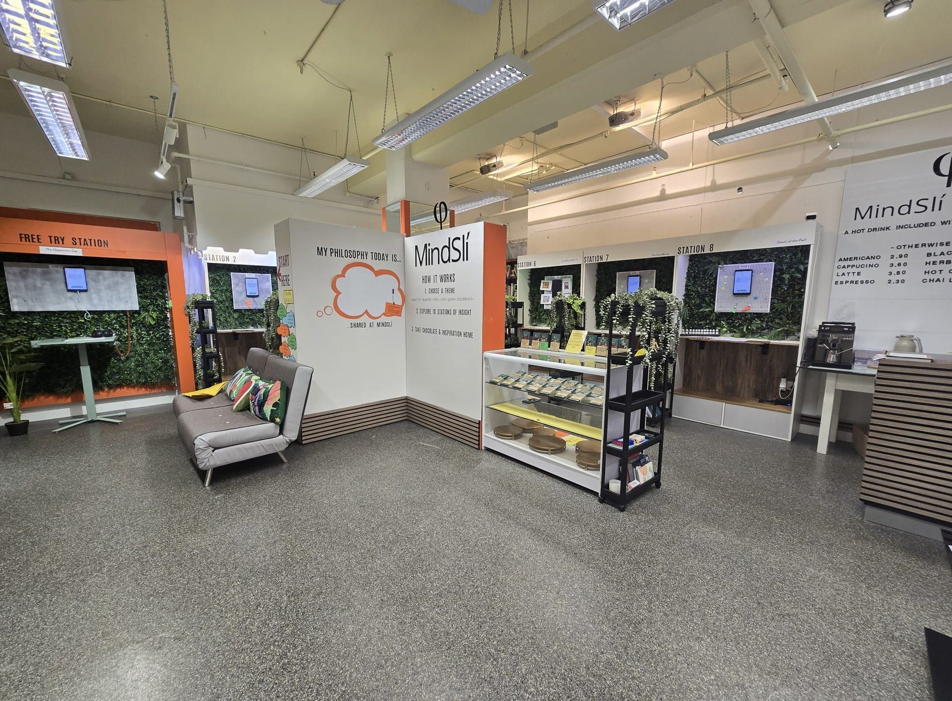 Interior of a room with seating area and a display counter with wellness products