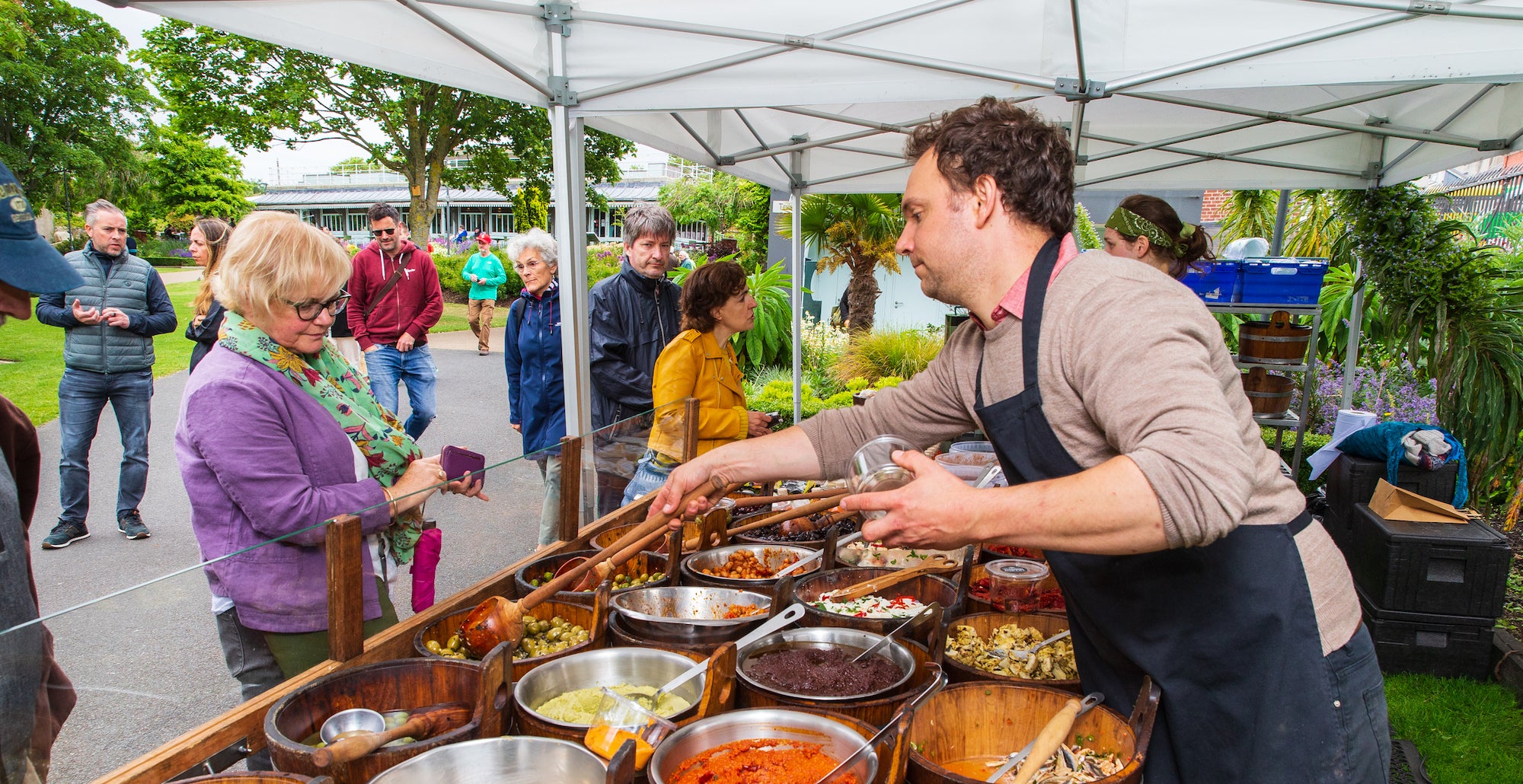 A vendor serving a customer at the People's Park Market in Dún Laoghaire, Co Dublin