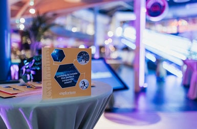 A brightly lit area with a display advertising Explorium