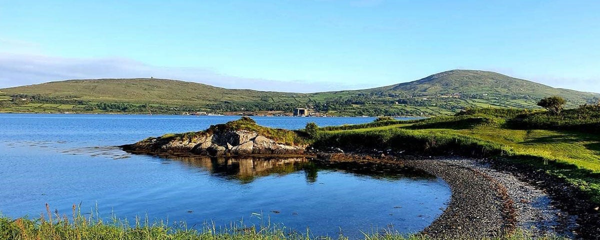 View of water and mountain at Berehaven Golf Club