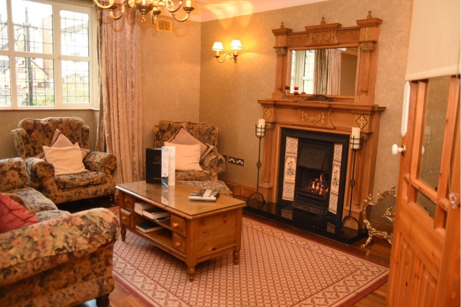 Sitting room with fireplace and seats
