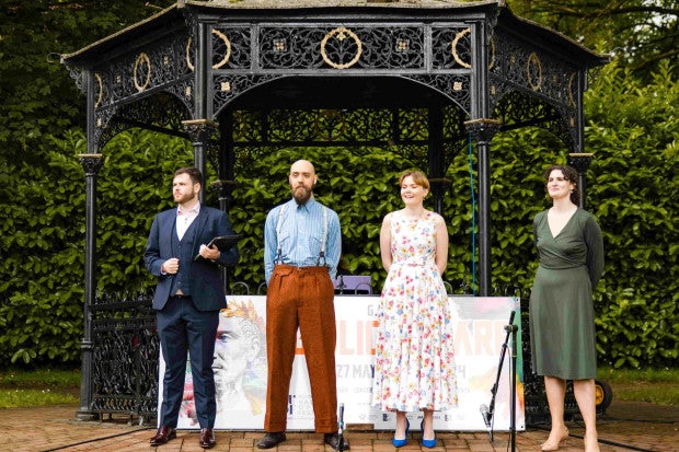 BVOF Opening Ceremony - Open Air Recital Lismore, 4 people standing in front of a small bandstand in a park.